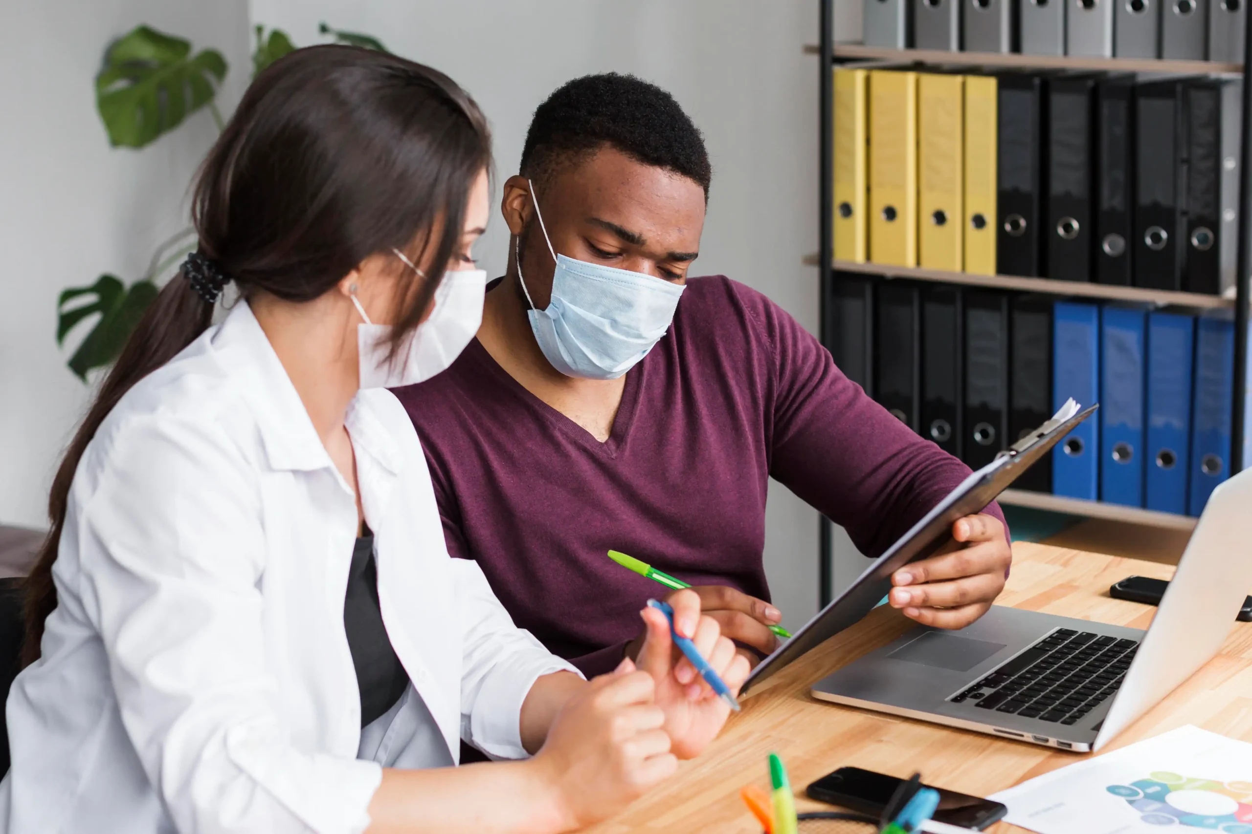 Two healthcare professionals discussing