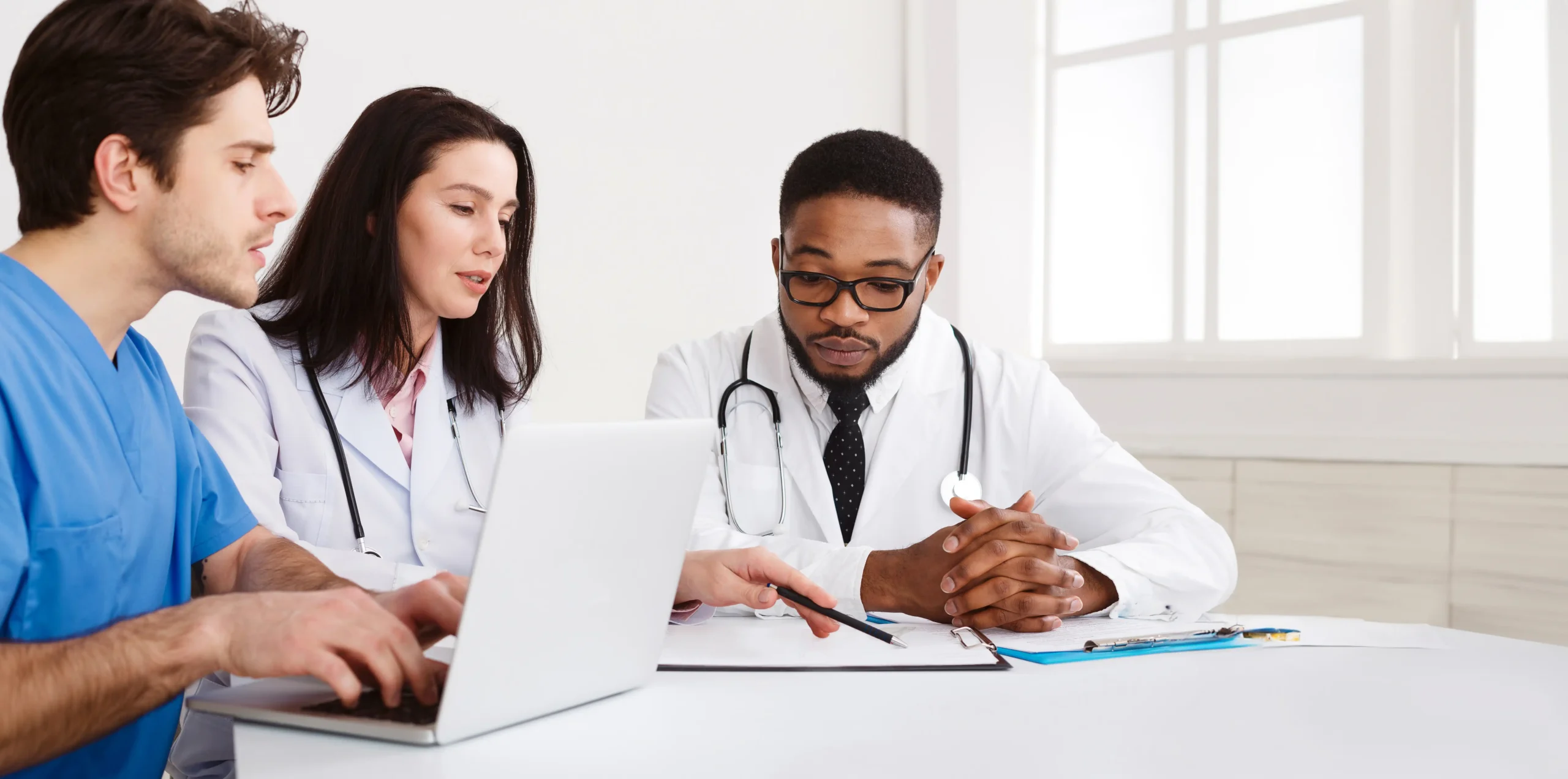 Doctors discussing reports and enter the in it