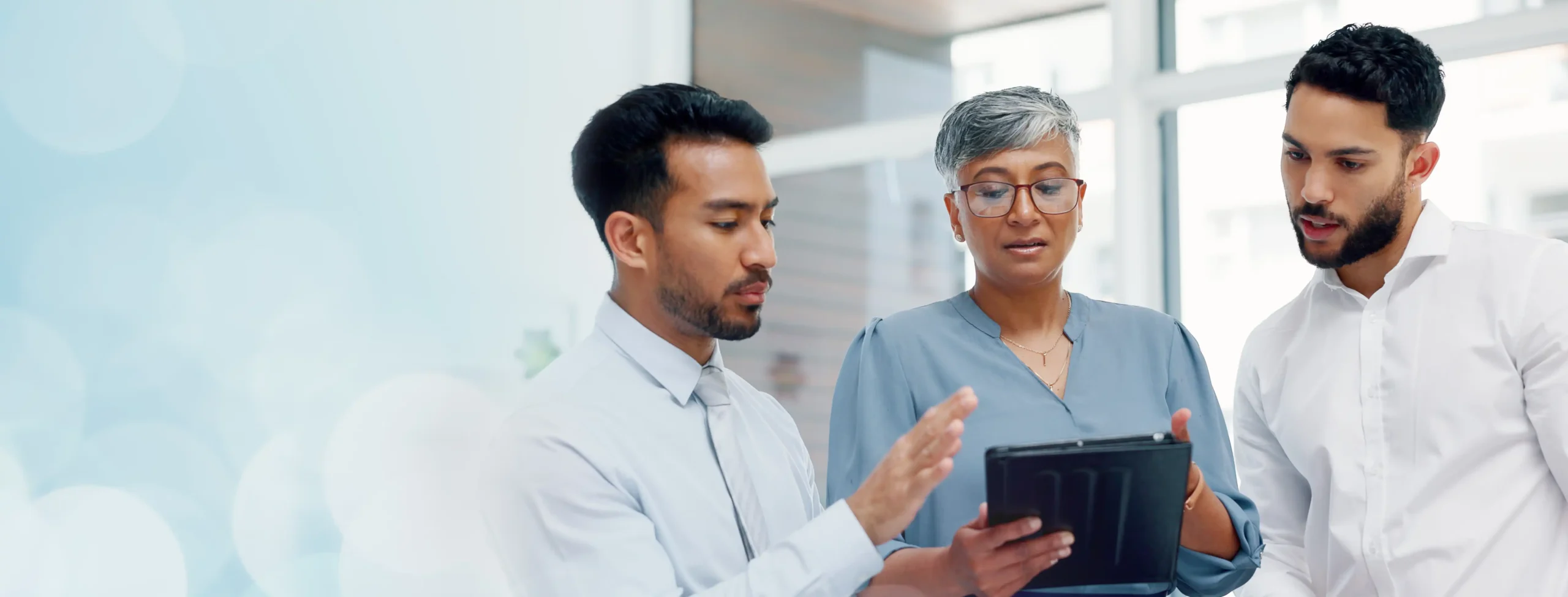 Doctors discussing over laptop in meeting